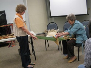 Laurel demonstrates backstrap weaving