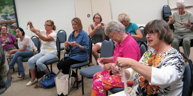 SHG members and Guests drop spindle spinning