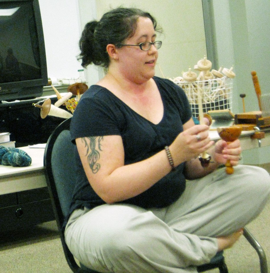 Holly demonstrates using a drop spindle
