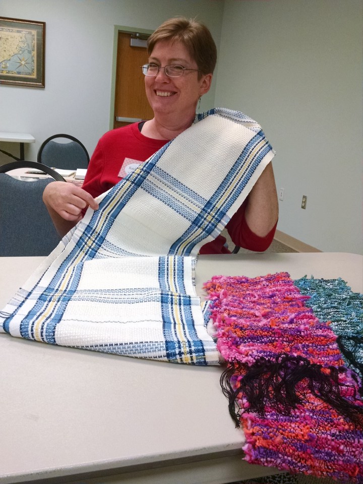 Kate with her place mats and a pair of scarves