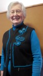 Betty used Anita Luvera Mayer's techniques for cords and beaded circles to change a solid color vest into a stunning accessory.